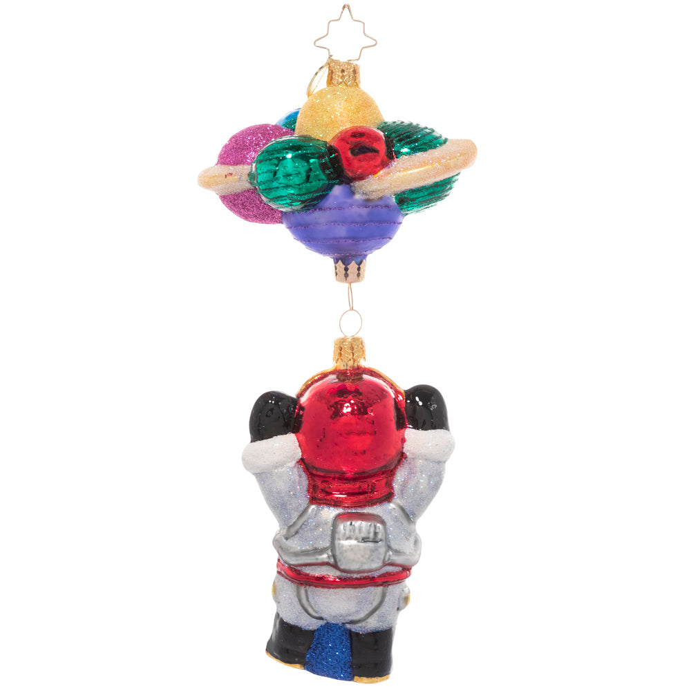 Back - Ornament Description - Santa in Space: 3…2…1…blast off! Santa is exploring the final frontier of space, bravely going where no elf has gone before! He grins from inside his space suit, dangling from a cluster of colorful planets.