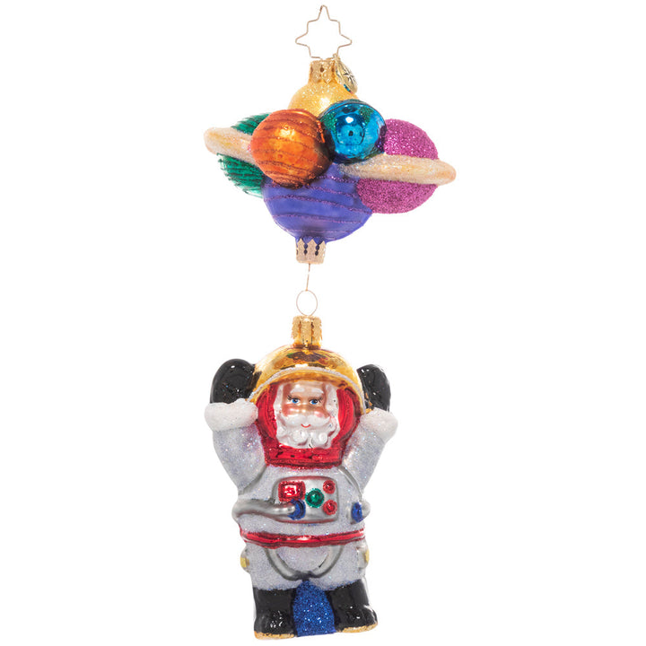 Front - Ornament Description - Santa in Space: 3…2…1…blast off! Santa is exploring the final frontier of space, bravely going where no elf has gone before! He grins from inside his space suit, dangling from a cluster of colorful planets.
