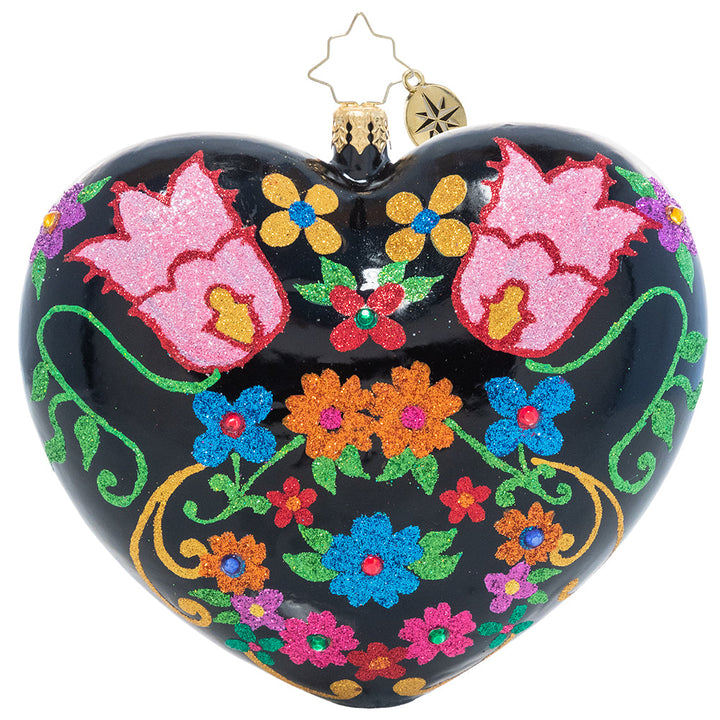 Back - Ornament Description - Sugar Skull Sweethearts: Remember those we've lost and celebrate love and life with this brightly colored heart-shaped ornament. Beautiful stylized flowers adorn one side while two sugar skull lovers wink out from the other on this Día de los Muertos-inspired ornament.