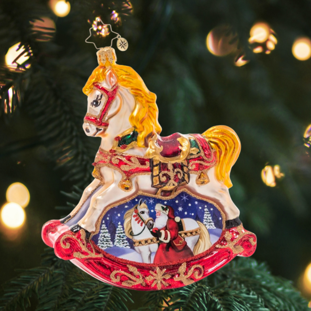 Ornament Description - Resplendent Rocking Horse: Shining in holiday colors of rich red, bright gold, emerald green and midnight blue, this ornate rocking horse embodies timeless Christmas tradition. The wintry vignette beneath reveals a sweet moment between Santa and his noble steed.