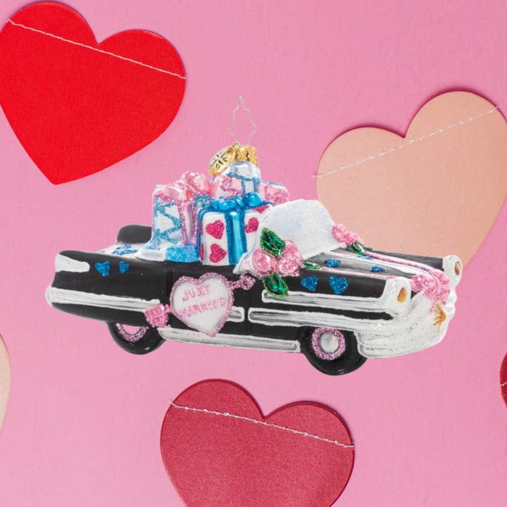 Ornament Description - Wedding Day Getaway: Now that's what I call a getaway car! Send the newlyweds off in style in this classic cruiser decorated with wedding florals and filled with wedding gifts.