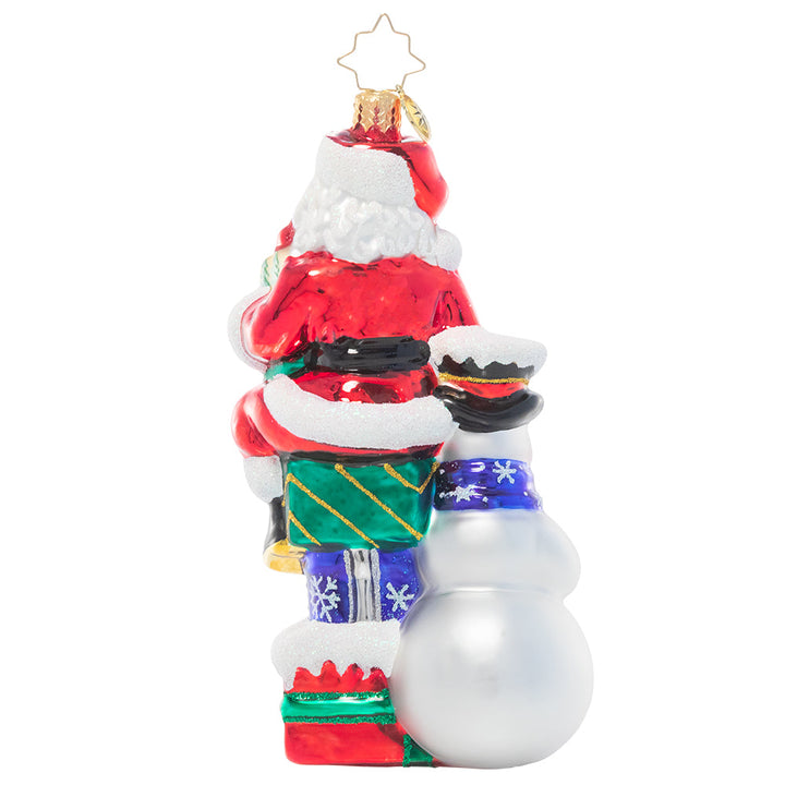 Back - Ornament Description - A Little Help From a Friend: Santa enlists the help of his snowman friend as he prepares for his Christmas deliveries. After all, that's what friends are for!