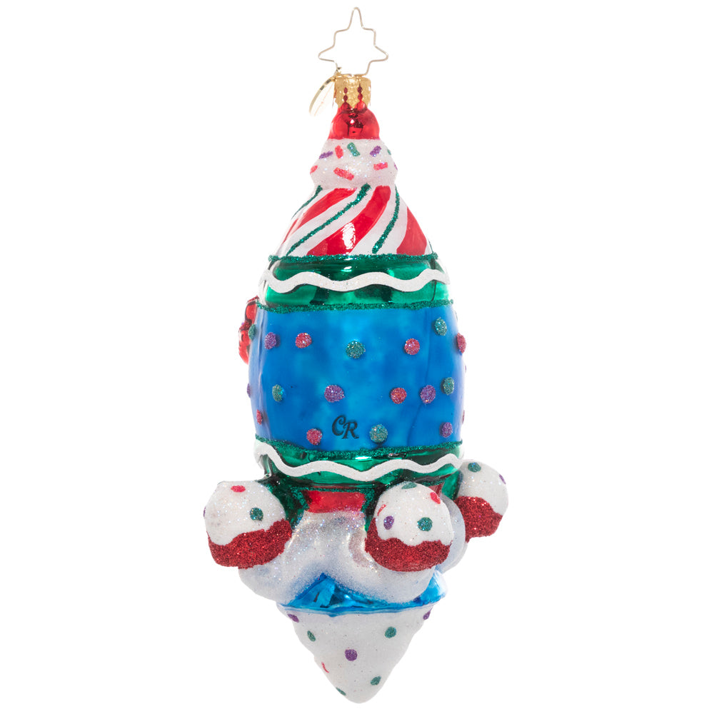 Back - Ornament Description - Tasts of Space: A super sweet rocket ship blasts into space piloted by a smiling gingerbread man. Good thing he's bundled up – it gets cold up there!