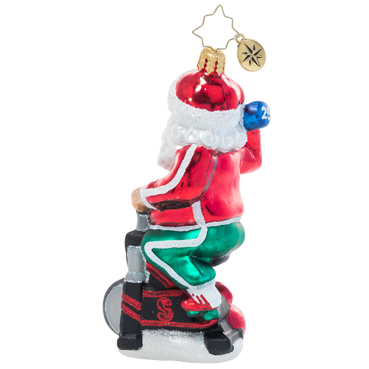 Back - Ornament Description - Santa Breaks a Sweat: Santa's no slouch! He works hard to keep himself in top Christmas shape for the demands of his busiest season; he's got to make room for lots of cookies and milk, after all!