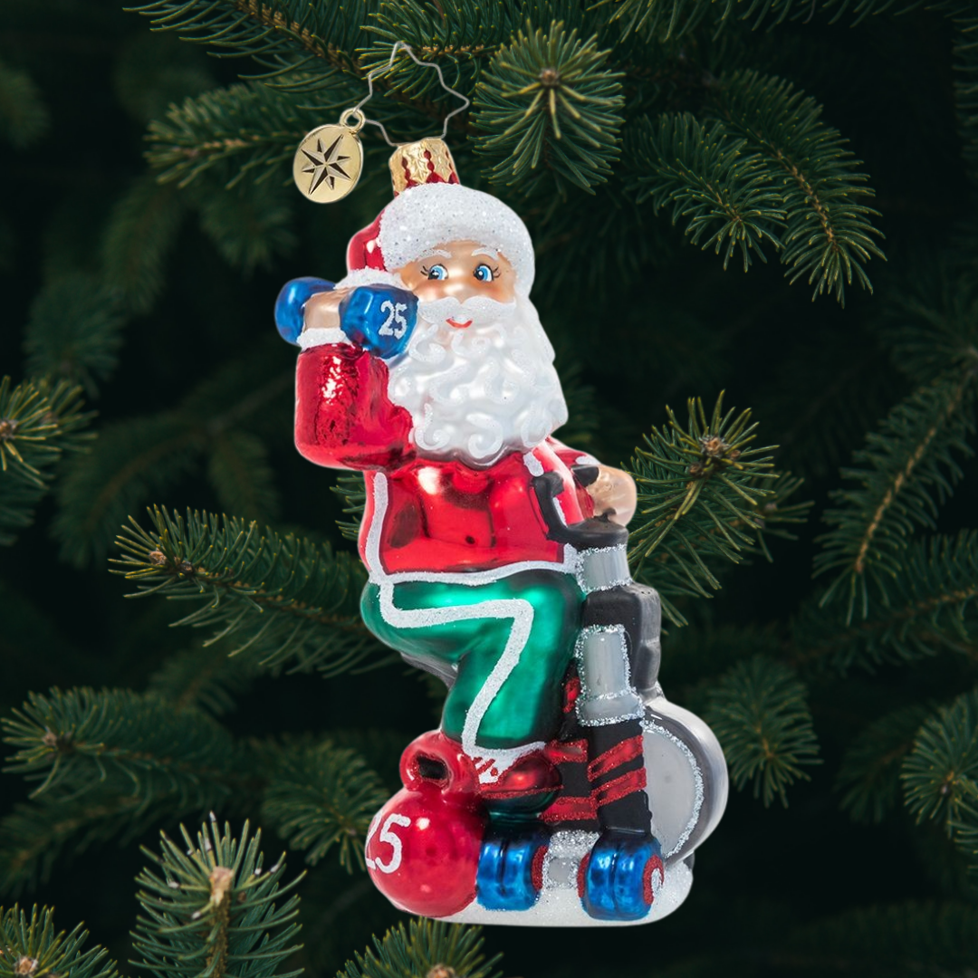 Ornament Description - Santa Breaks a Sweat: Santa's no slouch! He works hard to keep himself in top Christmas shape for the demands of his busiest season; he's got to make room for lots of cookies and milk, after all!