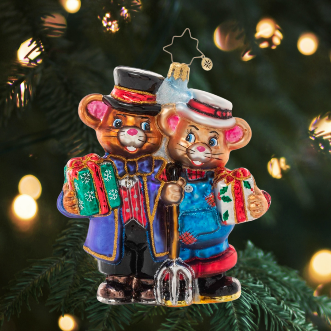 Ornament Description - A "Tail" of Two Cities: You know what they say--opposites attract! A simple city mouse and his posh country cousin come together to share the holiday and remember that we're all more alike than we are different.