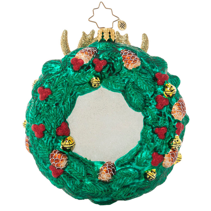 Back - Ornament Description - Rustic Reindeer Wreath: Dasher or Dancer, Prancer or Vixen? One of Santa's trusted regular-nosed reindeers peeks through a holiday wreath in this festive ornament.