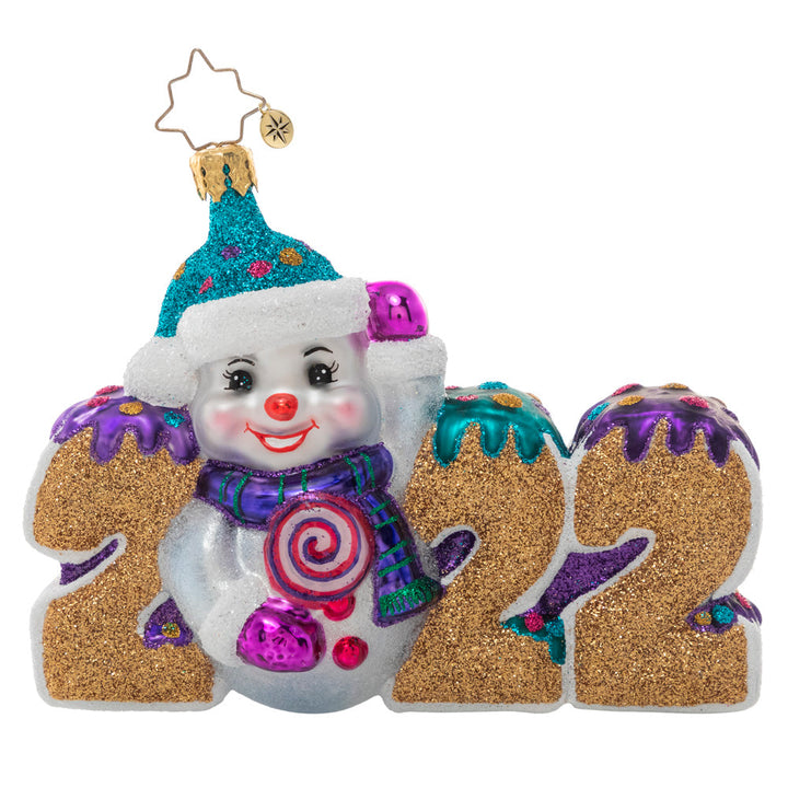 Ornaments - Description: Celebrate 2022 with this jolly ornament featuring a snowman and his candy stash. Here's hoping the year is a tasty treat for us all!