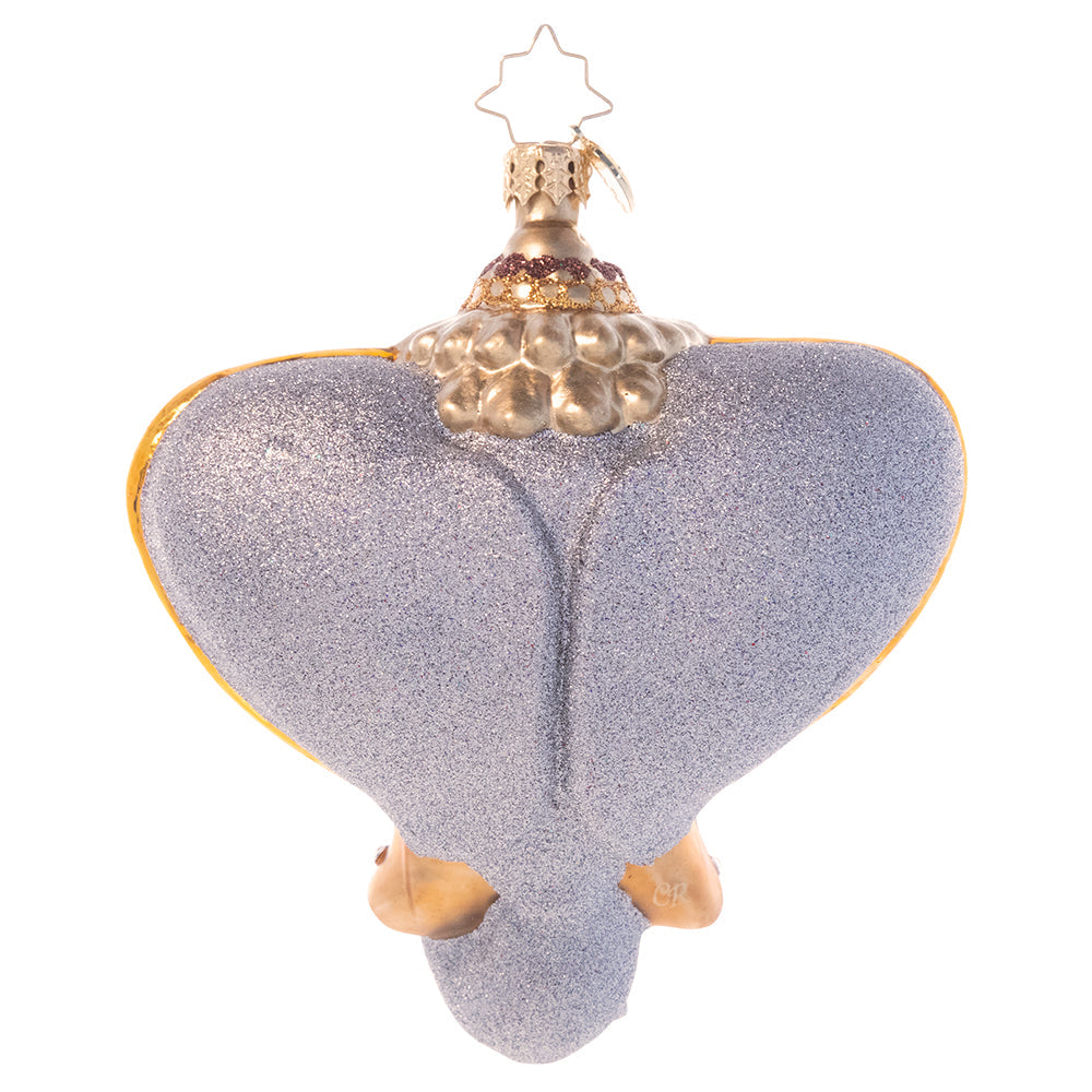 Back - Ornament Description - Opulent Elephant: Beckon the far east home with this stunning Indian elephant ornament. Adorned with bold jewels and rich gold, this elegant icon is said to bestow wisdom and good fortune to the home of all who possess it.