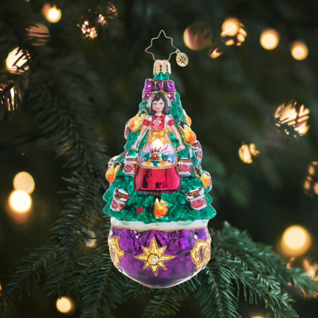 Ornament Description - Eight Maids-A-Milking: On the eighth day of Christmas, my true love gave to me…a very merry milk maid! She's been working octuple-time to keep up with her duties!