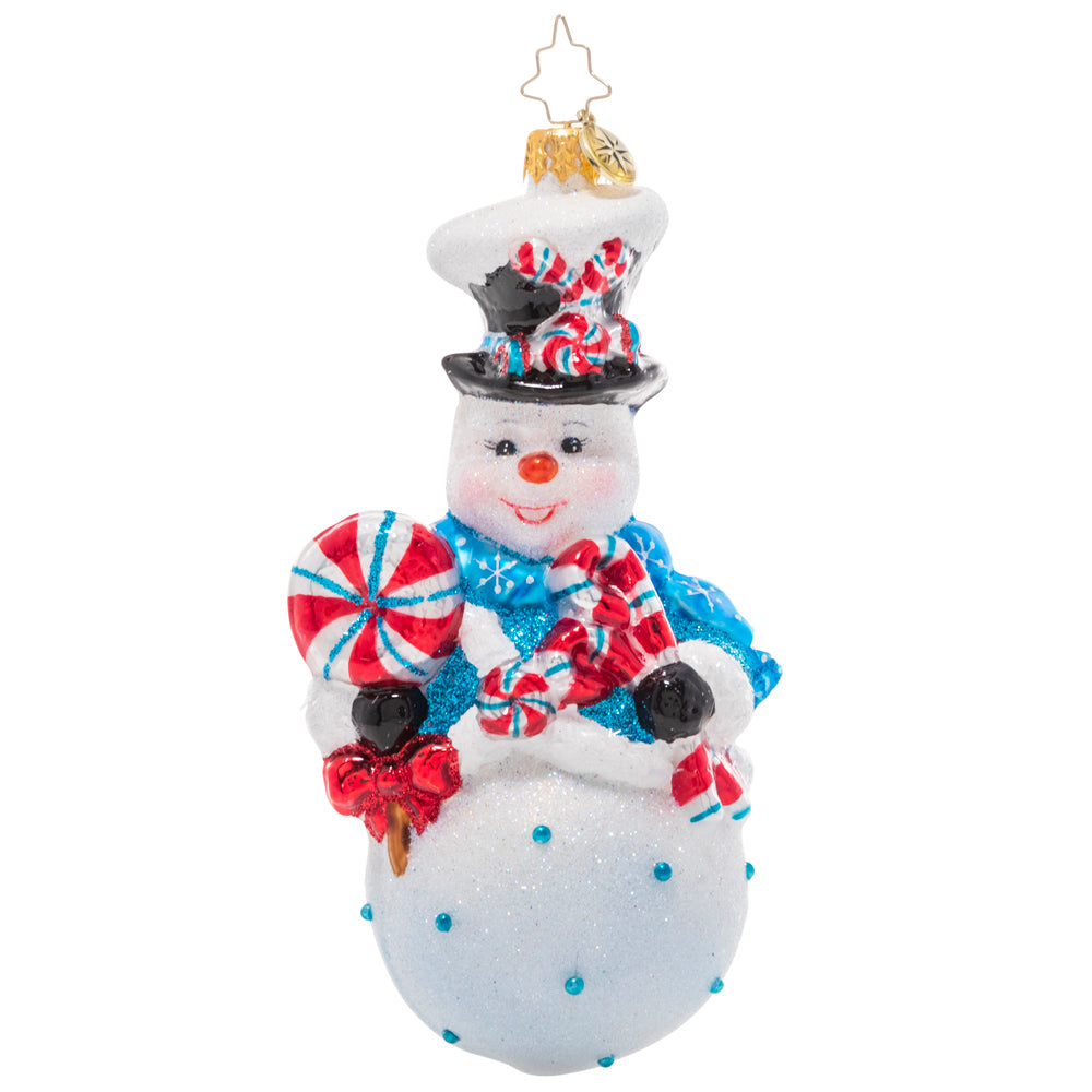 Front - Ornament Description - Minty Magic Snowman: Make this holiday season extra sweet with this whimsical treat-toting snowman! His rosy cheeks suggest he's been playing in the snow all day, so he's ready to wind down with his favorite sweet snacks!