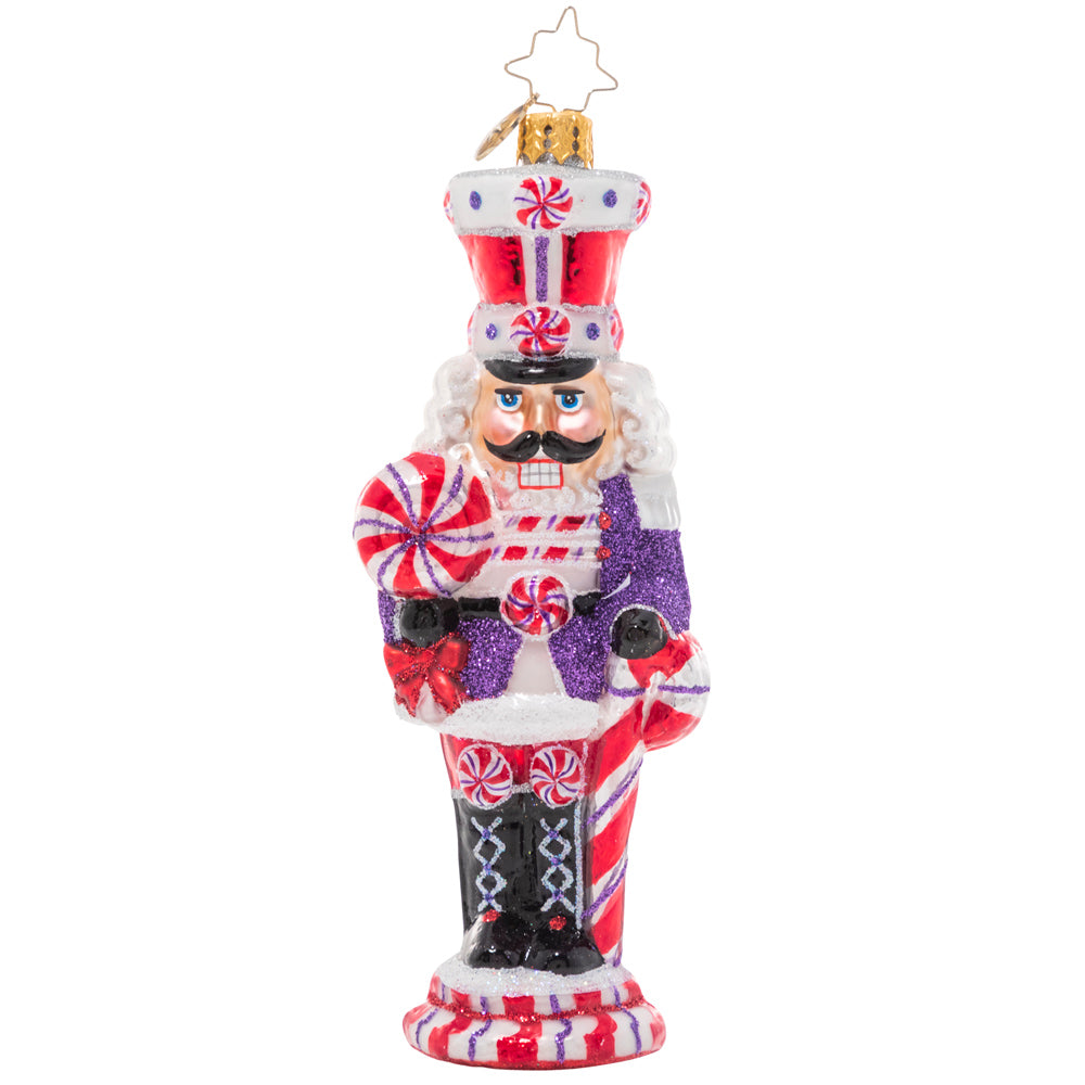 Front - Ornament Description - Candy Cane Cracker: How sweet it is! This peppy candy-cane themed nutcracker is ready to celebrate the holiday season in swirling red and white.