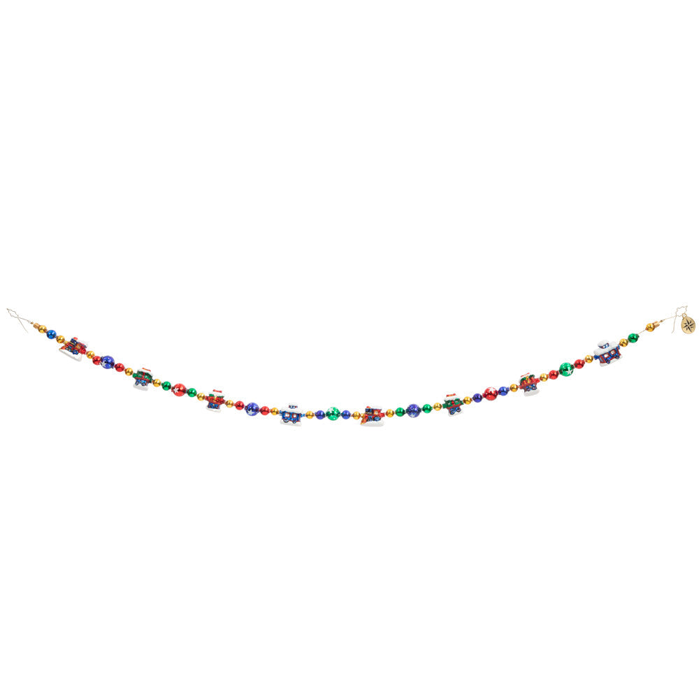 Trim/Garland Description - Choo Choo Garland: Choo choo! The Christmas train is coming through. Trim your tree in this unique garland featuring tiny colorful train cars. This photo shows how the garland may hang.