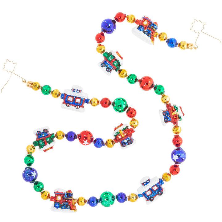 Trim/Garland Description - Choo Choo Garland: Choo choo! The Christmas train is coming through. Trim your tree in this unique garland featuring tiny colorful train cars.