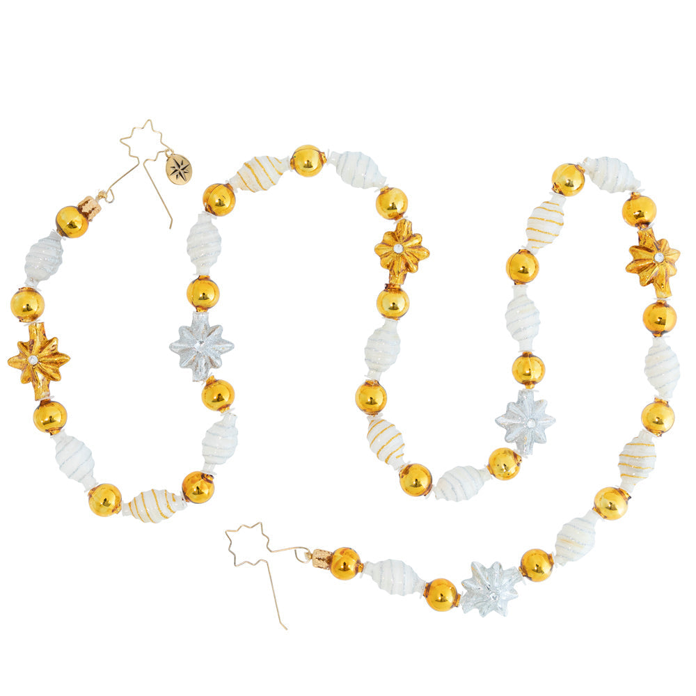 Trim - Description: Silver and gold, silver and gold, everyone wishes for silver and gold! Make those Christmas wishes come true with this glimmering garland strung from assorted metallic gold and silver beads.