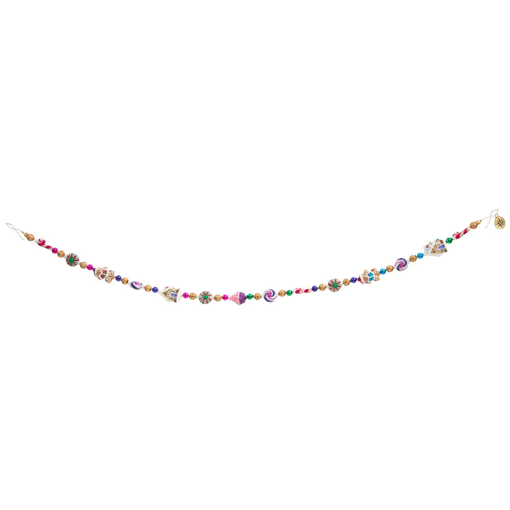 Garland/Trim Description - Sweet Treats Garland: Cupcakes, candy, and cookies, oh my! Make your holiday that much sweeter with this adorable garland featuring all sorts of tasty Christmas treats. This photo shows how the garland might hang. 
