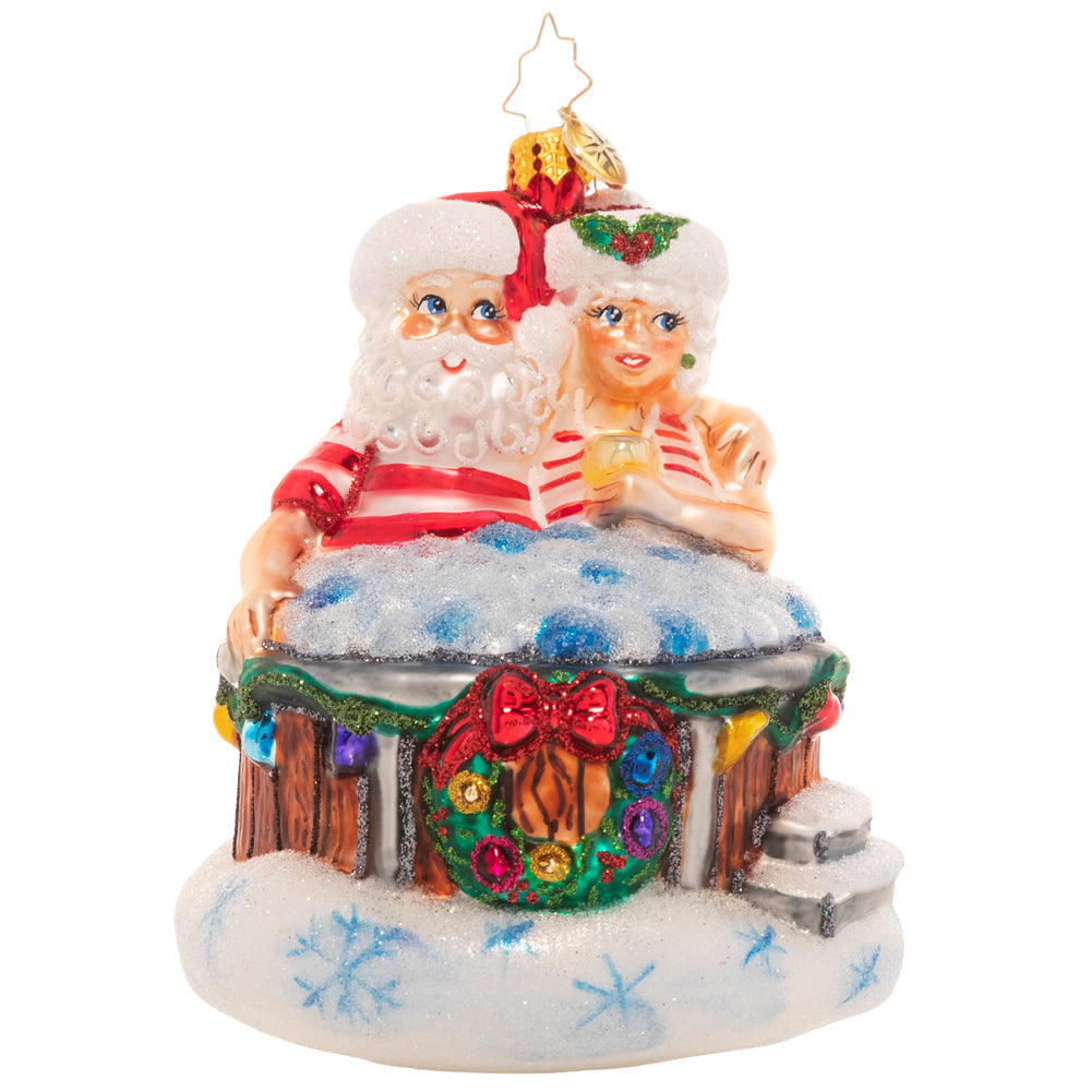 Front - Ornament Description - Holiday Hot Tub: There's nothing like a bubbling hot tub after a long day of baking and toy making! Mr. and Mrs. Claus take a well-deserved break to rest and relax.
