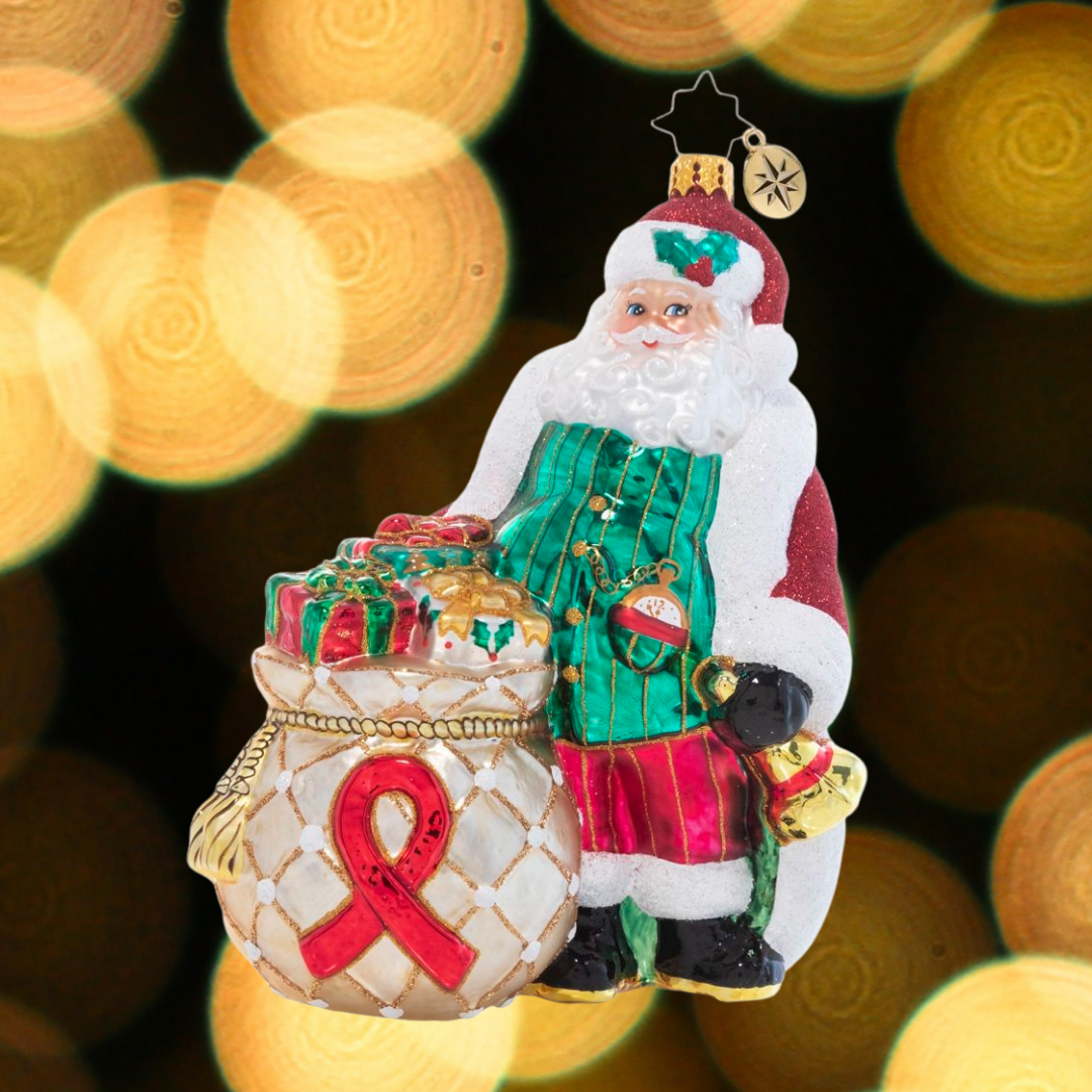 Ornament Description - AIDS Awareness Santa: Santa knows that the Christmas season is nothing without an open heart and love for our fellow man – he's spreading not just Christmas cheer, but also compassion and awareness for AIDS. A percentage of the sales from this ornament will benefit AIDS awareness.