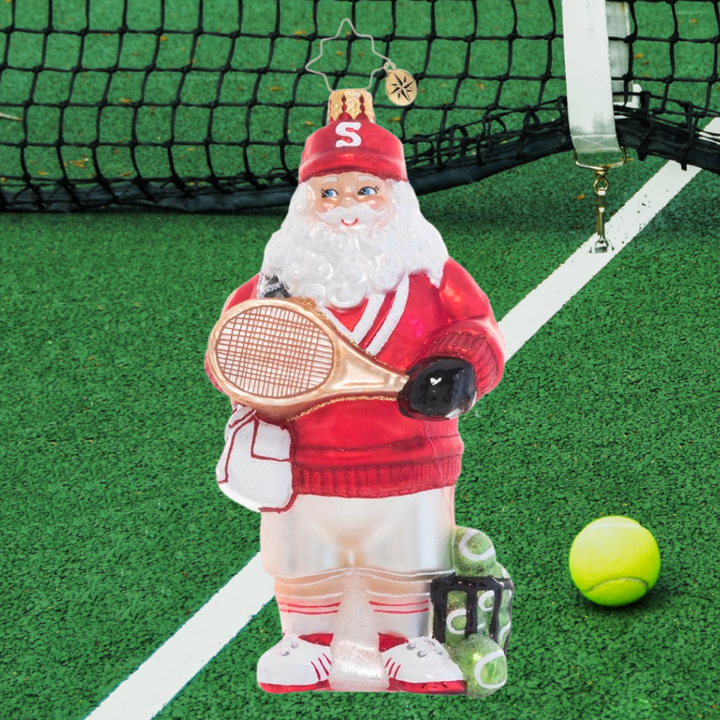 Ornament Description - Tennis Ace Santa: Game, set, match! Santa grabs his gear and preps to warm up for the big North Pole tennis tournament. Go Santa!