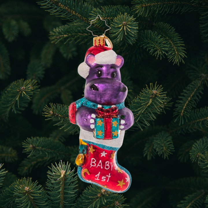 Ornament Description - Big Baby's First Christmas: Who wouldn't want a hippopotamus for Christmas? Celebrate the arrival of the new baby in your life with this adorable purple baby hippopotamus – he's the perfect stocking stuffer!