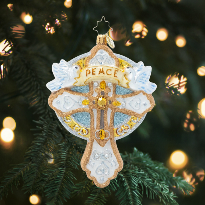 Ornament Description - Golden Cross of Peace: Peace on earth and mercy mild – keep the true spirit of Christmas alive with this delicate cross-shaped ornament.