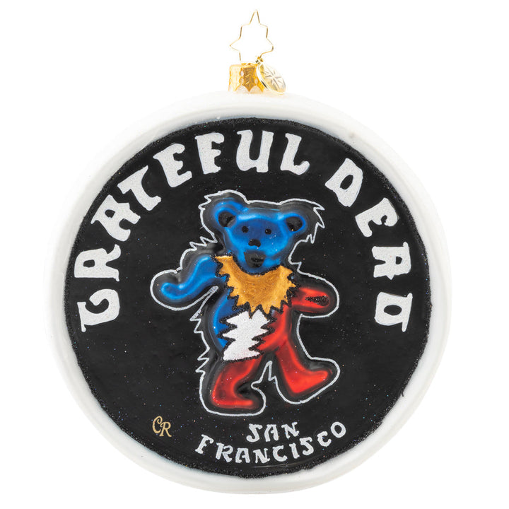 Back - Ornament Description - Dead Head Disc. : Dead Heads unite! Show some love for your favorite band with this disc-shaped ornament featuring two of the most recognizable Grateful Dead icons: their Dancing Bear and "Steal Your Face" skull. Whether for yourself or another Grateful Dead fan in your life, this piece will no doubt add some serious rock n' roll cred to any tree!