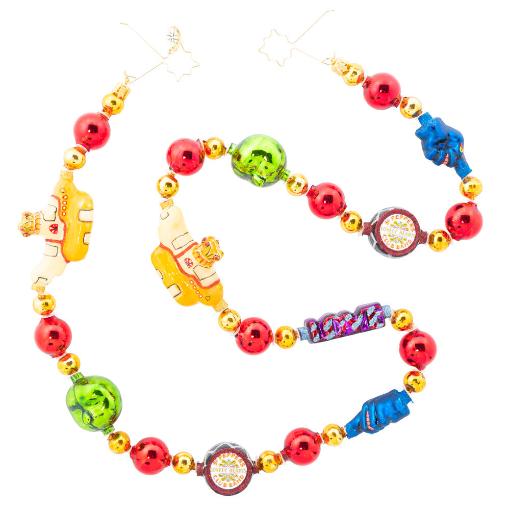 Garland/Trim Description - Yellow Sub Baubles: All Together Now! Trim your tree with this fun garland featuring icons of The Beatles' fictional adventure to Pepperland: Blue Meanies, green apples, Sergeant Pepper's drum, LOVE, and a yellow submarine.