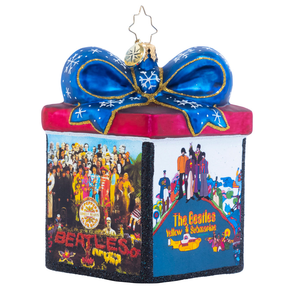 Ornament Description - The Gift of The Beatles: Now this is our kind of music box! Featuring the cover art for four of the Beatles' later albums, this dazzling gift box ornament is the ideal addition to any fan's collection.