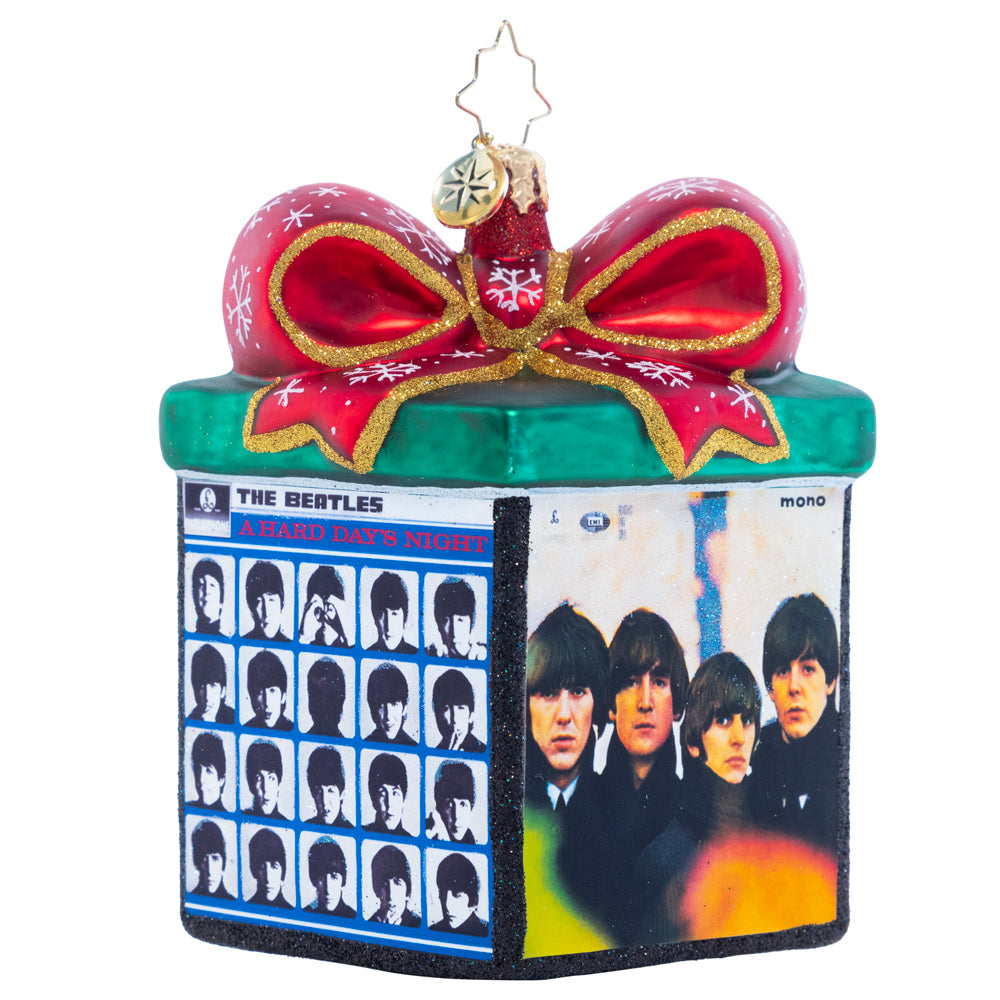 Ornament Description - Boxed Up Bundles: Tied up with a sparkling bow, this miniature gift box highlights four of The Beatles' iconic albums. Let this piece inspire you to play one as you decorate your tree!