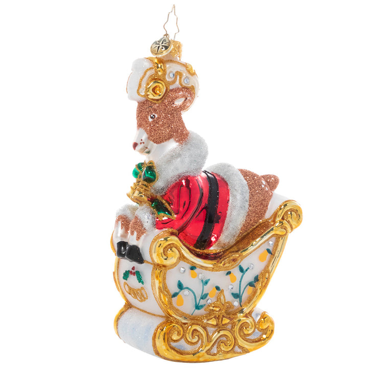 Front - Ornament Description - Gleaming Golden Rings: On the fifth day of Christmas, my true love gave to me…a cheeky reindeer driving Santa's sleigh! The gilded sleigh, adorned with floral accents and a crest of five golden rings, flies through the air with Dasher at the helm. This and eleven additional fun pieces are available as part of our Ornament of the Month collection!