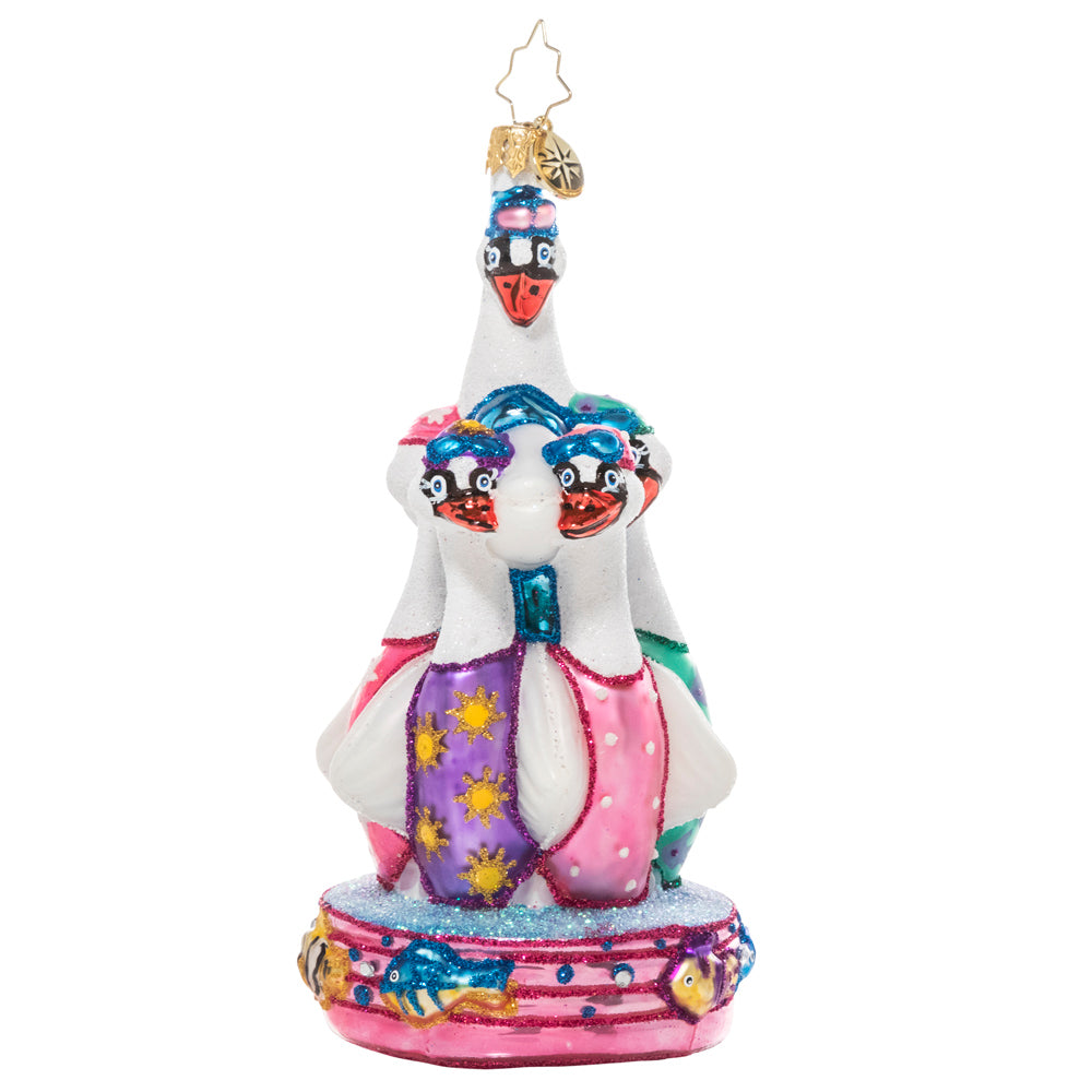 Front - Ornament Description - Seven Synchronized Swans: On the seventh day of Christmas, my true love gave to me…seven swans a swimming! These fancy feathered friends don their caps and goggles in preparation for their holiday synchronized swimming showcase. 
