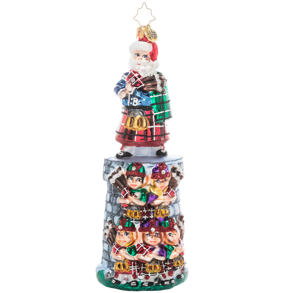 Front - Ornament Description - Piper Posse: The penultimate addition to our Ornament of the Month series, this piece celebrates the 11th day of Christmas. You can practically hear the music coming from this team of tiny bagpipers led by their eleventh member and Christmas king himself, Santa Claus!