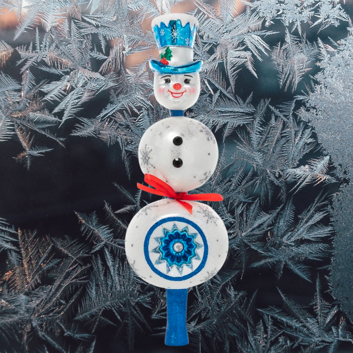 Finial Description - Splendid Snowman Finial: This festive snowman has been promoted to tree-topper this year! Put this jolly fellow atop the tree, he'll be sure to keep things cool.