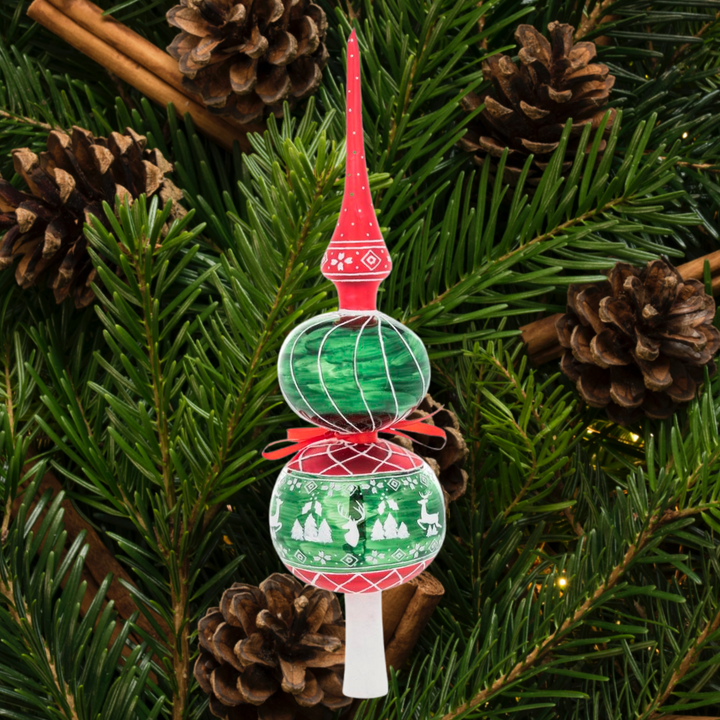 Finial Description - A Rustic Christmas Finial: This ornate spire finial will be the perfect finishing touch on your tree this year. With forest green, deep reds and white Nordic-inspired Christmas imagery, it's a traditional yet unexpected piece for the top of any tree!