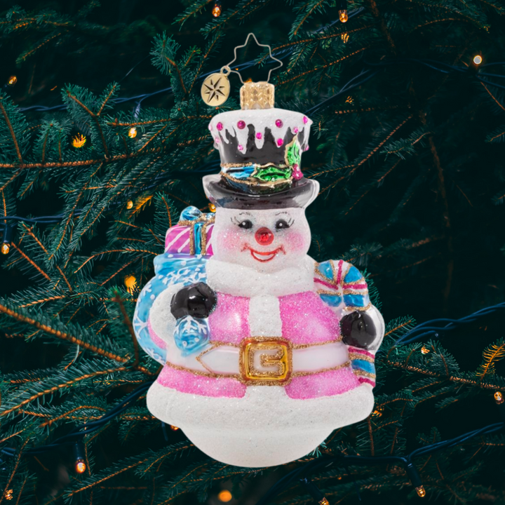 Ornament Description - Pink Peppermint Snowman: The snow is falling! This snowman is all dressed up for his favorite season of all in a pale pink outfit with light blue accessories. 