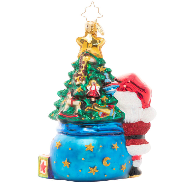 Back - Ornament Description - Extra Special Delivery: This adorable Santa has taken extra special care of the latest addition to his nice list – a new baby in the family! Celebrate their first Christmas with this darling ornament featuring a tiny tree decorated with special treasures to delight any little one.
