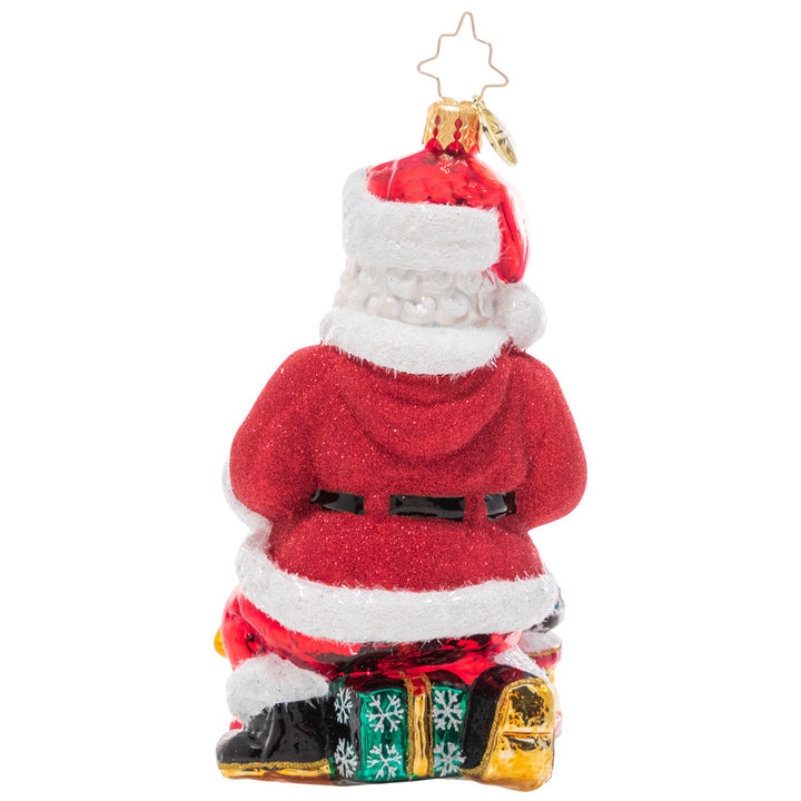 Back - Ornament Description - Santa's Ton Of Toys: Santa looks perfectly prepared with his massive pile of toys for good little girls and boys! This traditional Santa is sure to delight!