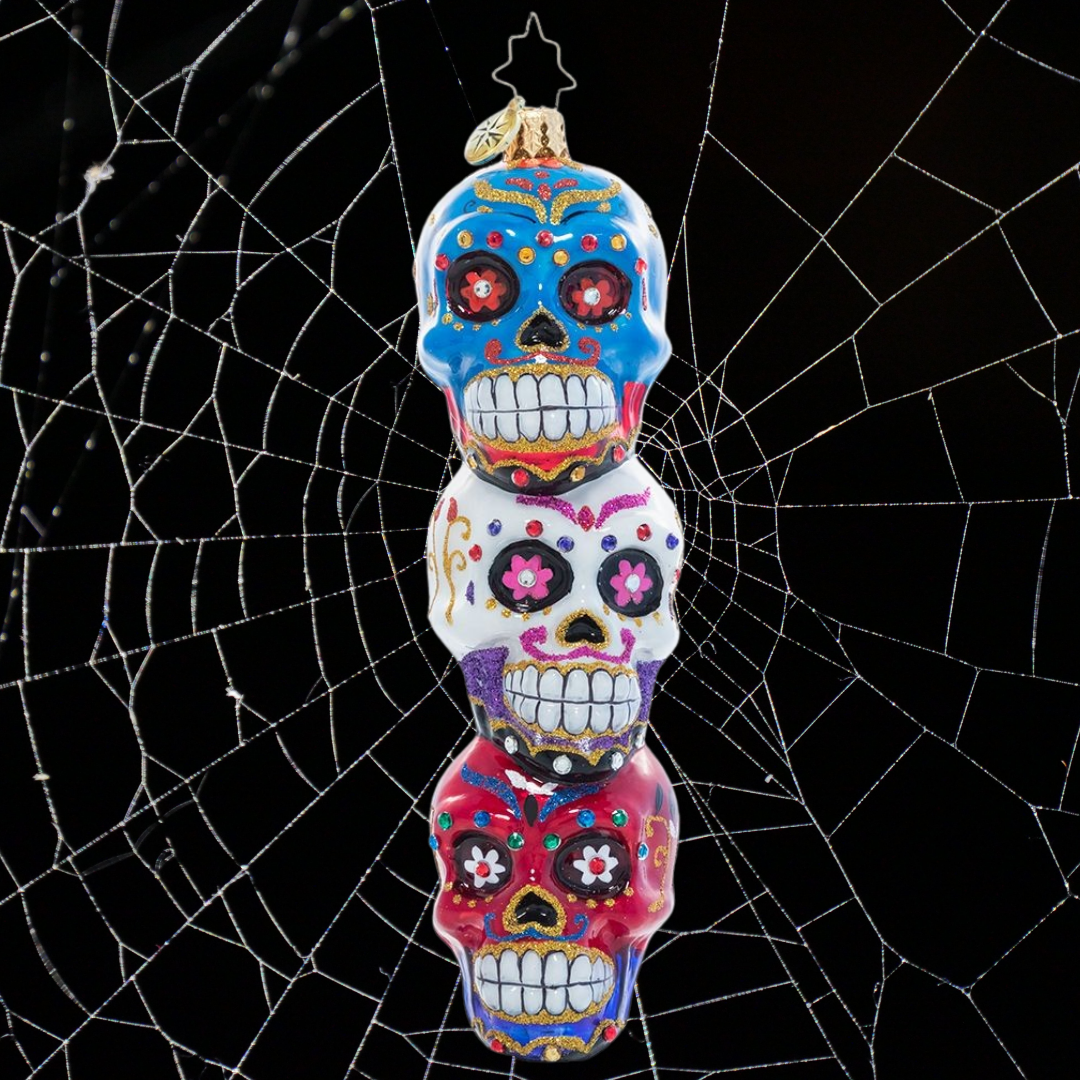 Ornament Description - Spooky Sugar Skulls: Triple the tricks, triple the treats! Trim your Halloween tree with this trio of colorful stacked sugar skulls.