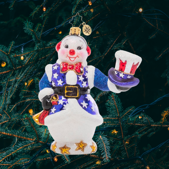Ornament Description - Star Spangled Snowman: This snowman is showing his patriotic pride! He tips his hat to the country he loves as he prepares to play the bugle for the town celebration.