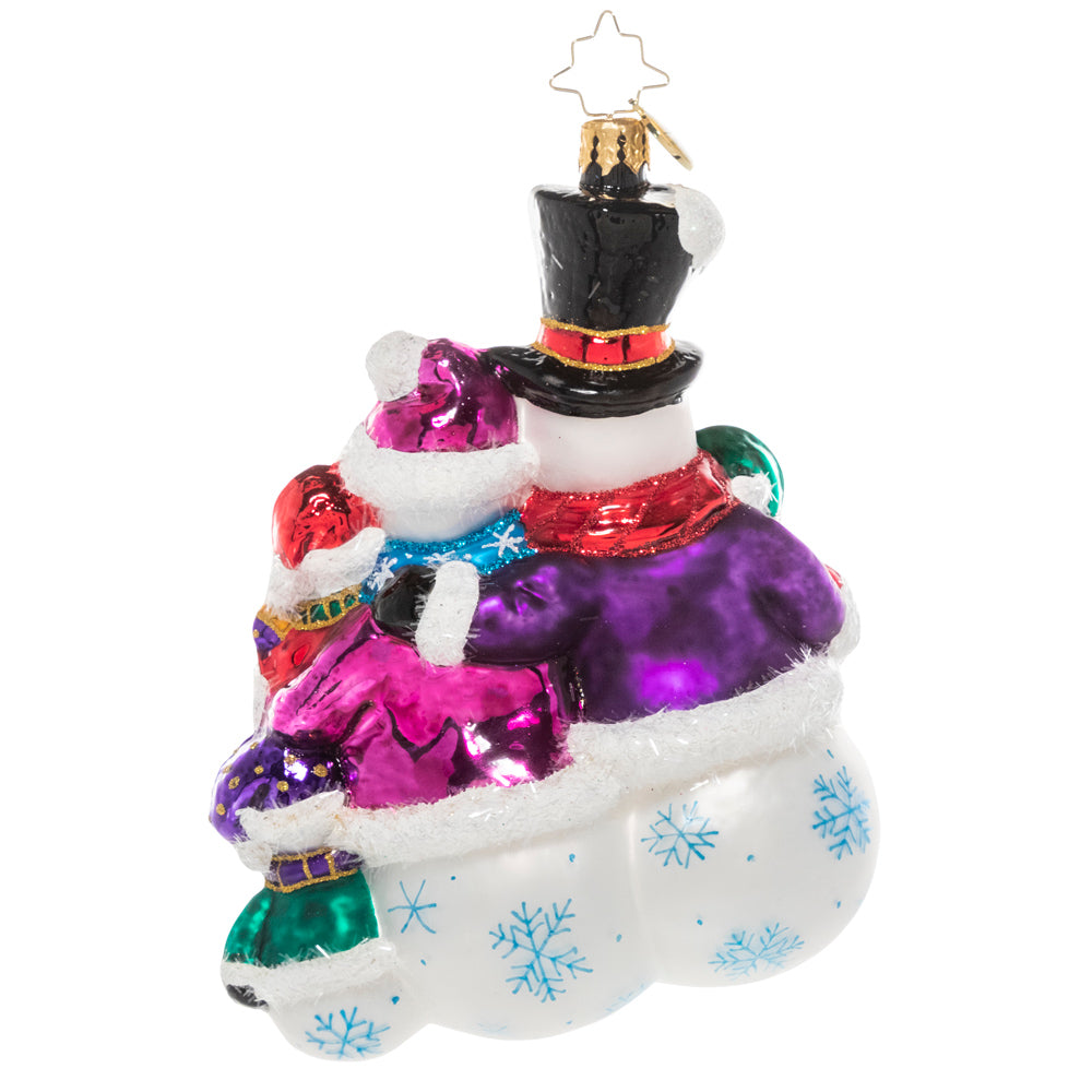 Back - Ornament Description - The Frosty Family: They may be made of snow, but these frosty folks know the warmth of a family! They snuggle together for a group hug before joining their friends for some winter fun.