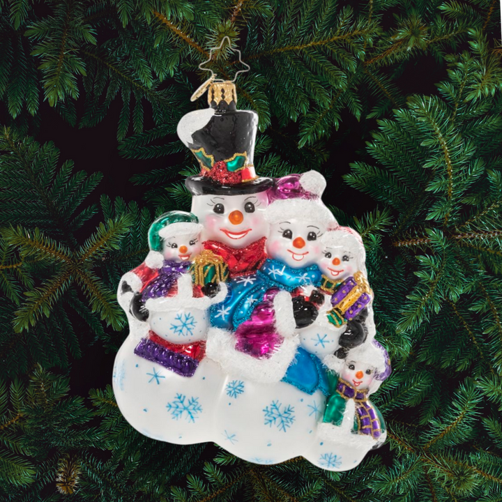 Ornament Description - The Frosty Family: They may be made of snow, but these frosty folks know the warmth of a family! They snuggle together for a group hug before joining their friends for some winter fun.