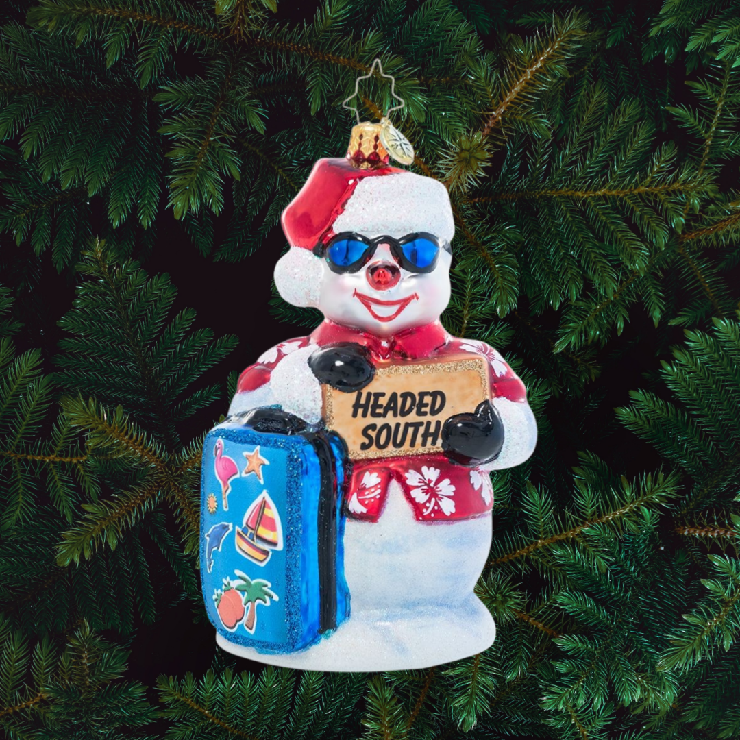 Ornament Description - Out of Office Snowman: This snowman is pretty cold already, but now he's ready to chill! He's heading south to vacation in the sunny weather – hope he packed his SPF 10,000!