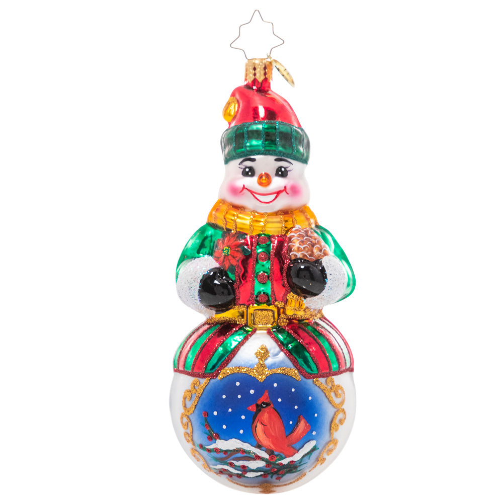 Ornament Description - Guardian of the Forest: Many animals avoid the cold winters by hibernating or migrating to warmer weather. This snowman celebrates his friend the cardinal, who chooses to stay – and wears a festive red coat for the occasion!