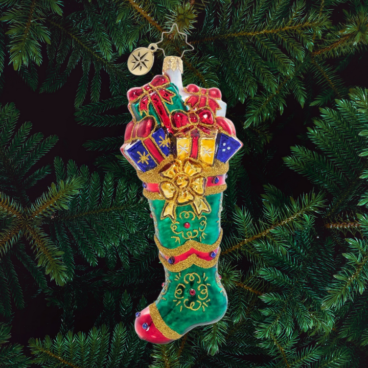 Ornament Description - Splendid Stocking: Someone has been extra good this year! An emerald green stocking has been stuffed full of goodies to delight and thrill on Christmas morning.