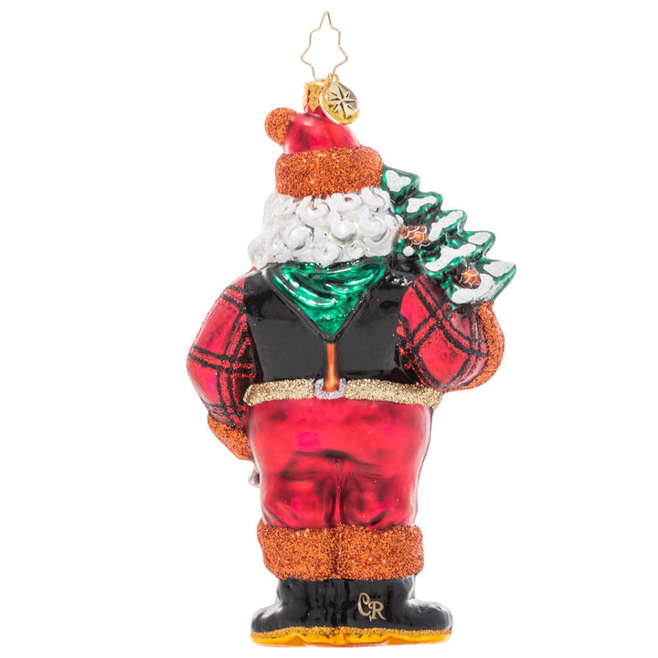 Back - Ornament Description - Winter Woodsman Santa: Santa has spent all day trekking through the snowy North Pole woods in search of the perfect Christmas tree for the Claus household…and he's finally found the one! He poses proudly with his selection slung over his shoulder. Now it's time to decorate!