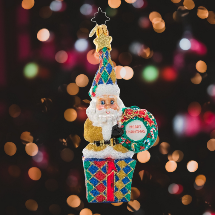 Ornament Description - Christmas Wishes Santa: Dressed in a glittering gold jacket and jewel-toned hat, it's clear that this Santa's favorite thing about Christmas is all the shiny things! He's sending wishes for a holiday filled with good fortune!