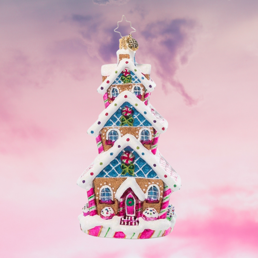 Ornament Description - Sweetest Highrise: This charming tri-level treat is triple the fun! Covered in Christmas candies and icing snow drifts, this charming gingerbread cottage shows off some of what makes this season so very sweet.