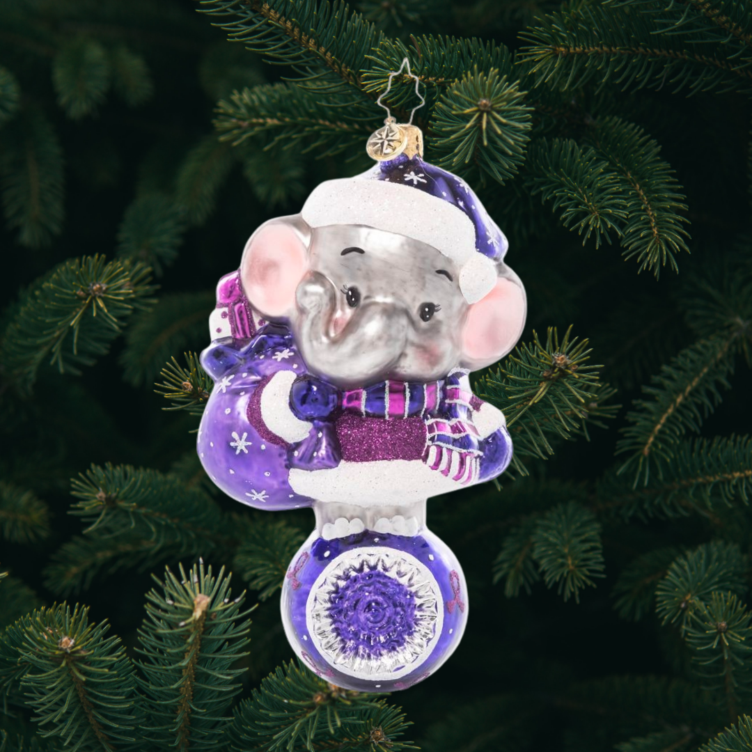 Ornament Description - Love Never Forgets: With big ears and an even bigger heart, an adorable elephant dons all his purple duds in honor of Alzheimer's Awareness. After all, an elephant never forgets, and he wants us to remember this important cause too! A percentage of the sales from this ornament will benefit Alzheimer's charities.