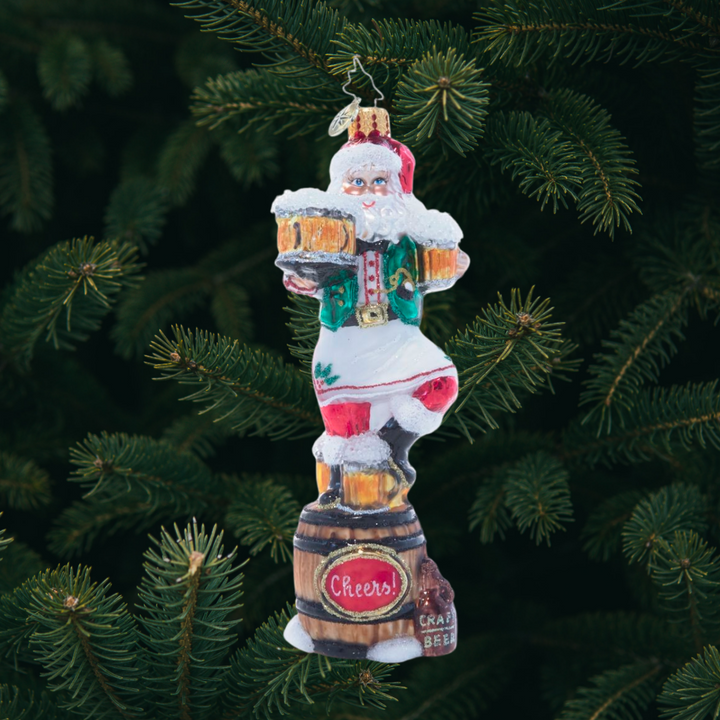 Ornament Description - Three Cheers For Santa: Santa knows what the holidays are all about – good food, good friends, and of course, good drinks. Three cheers for the season!