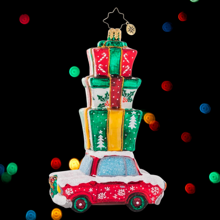 Ornament Description - Holiday Driver: Beep beep! Here comes Christmas! This classic car is piled high with presents, ready to surprise and delight.